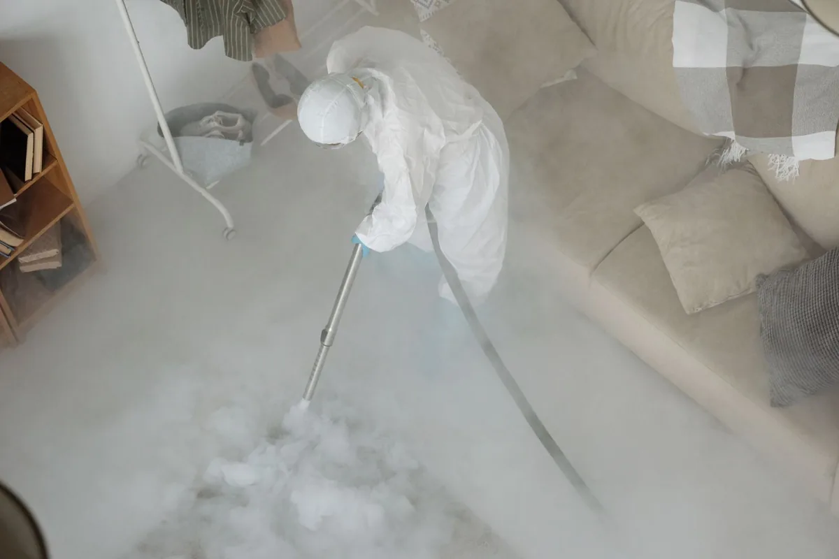 Biohazard cleanup technician in protective equipment, Carrollton, GA